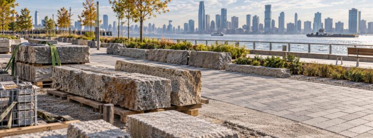 Conceptual reclaimed granite block returning to service in a resilient waterfront hardscape project.